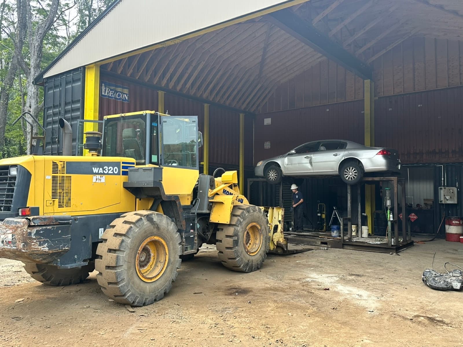 A vehicle up on the lift being stripped at AMR