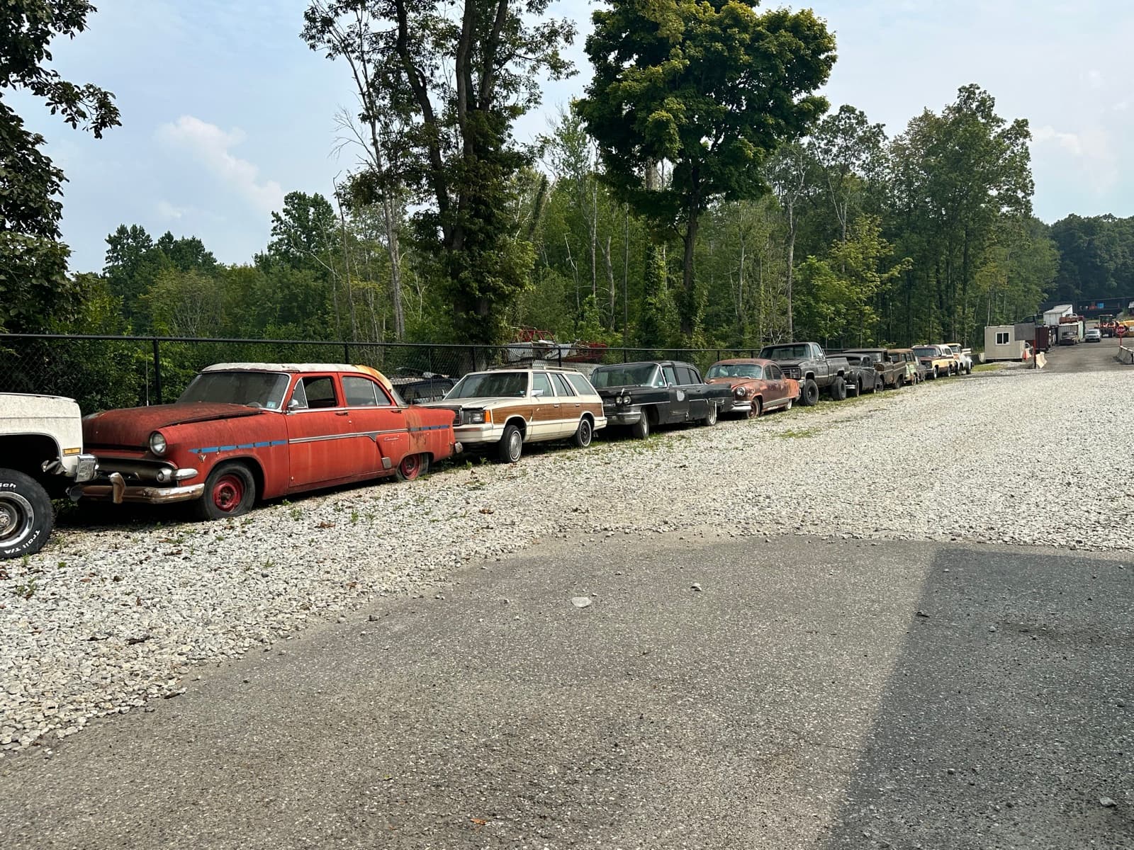 A row of older vehicles waiting at the AMR yard