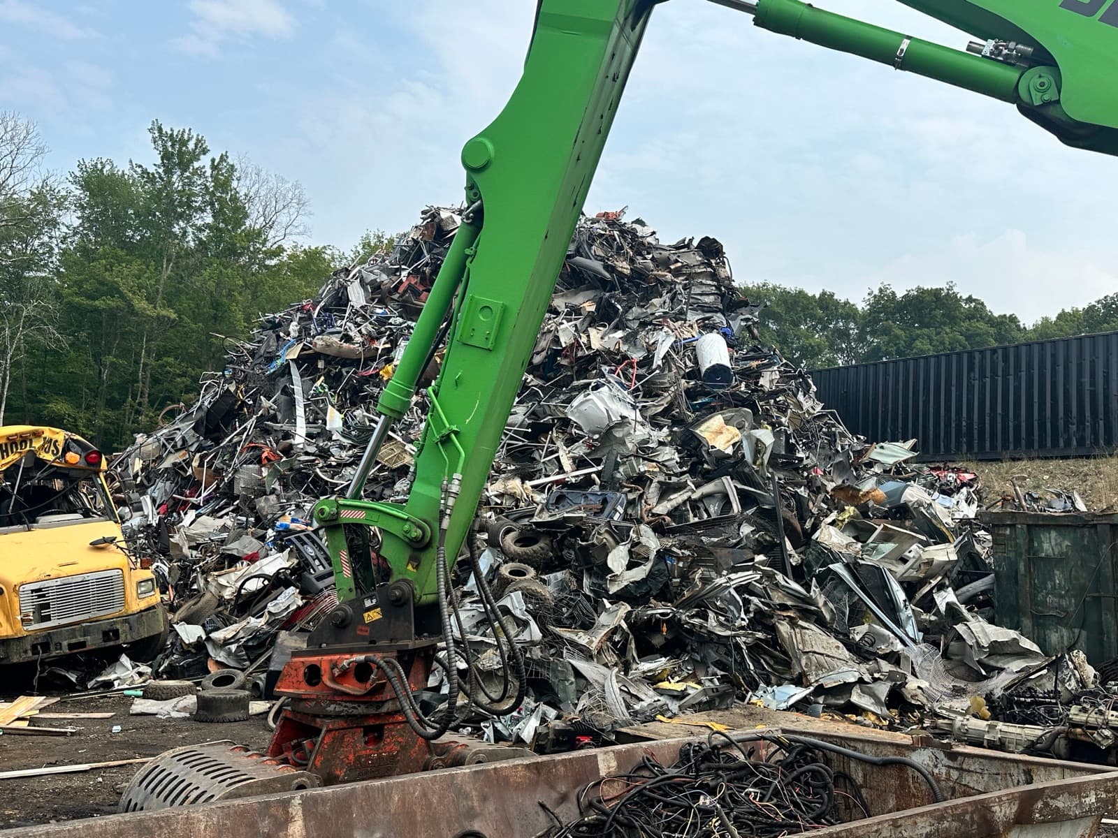 The material handler's boom over the scrap pile at AMR